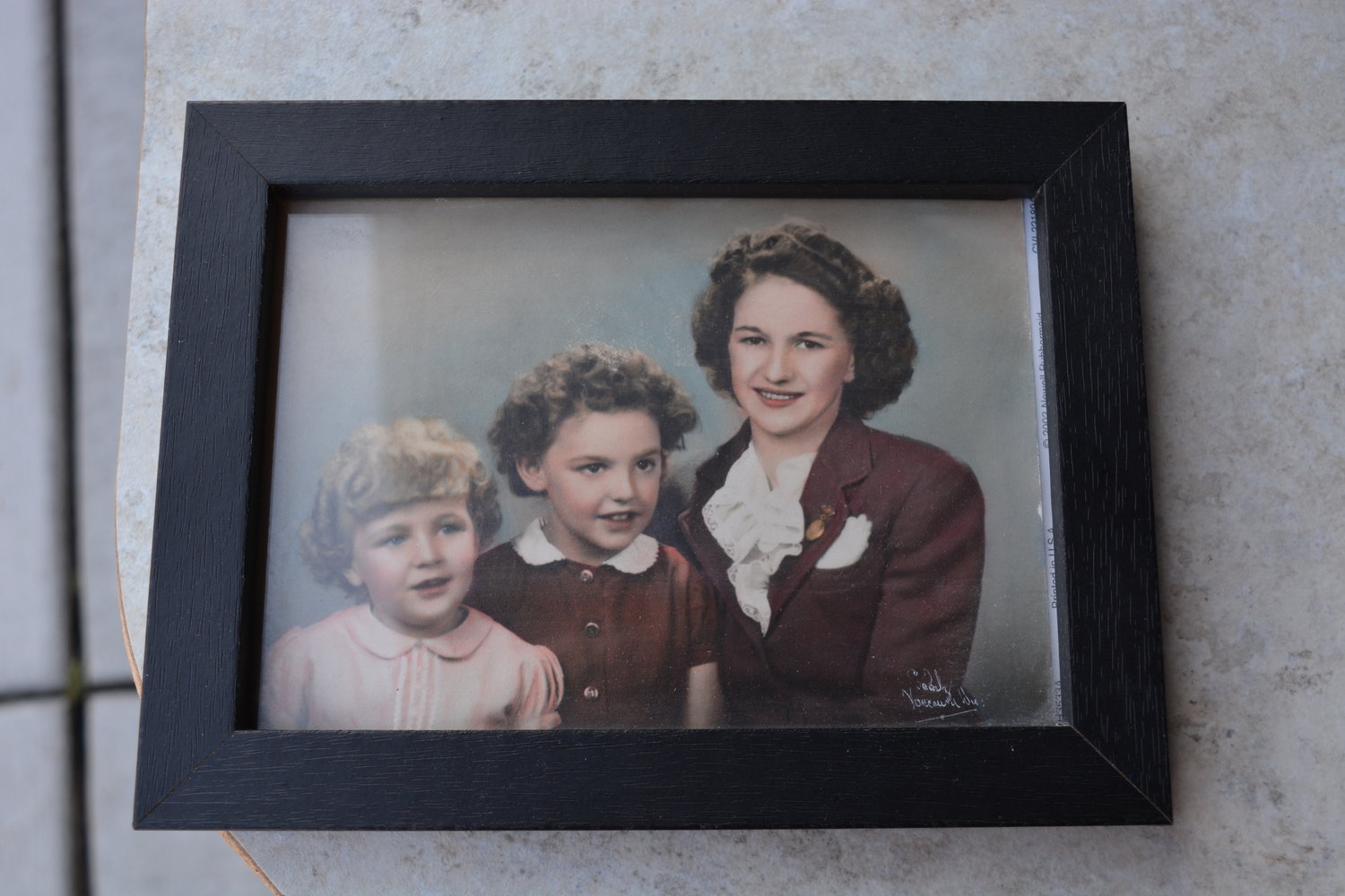 Helen (right) sits with her two daughters Gloria (left) and Ruthie during a photo taken around 1945 to 1946.