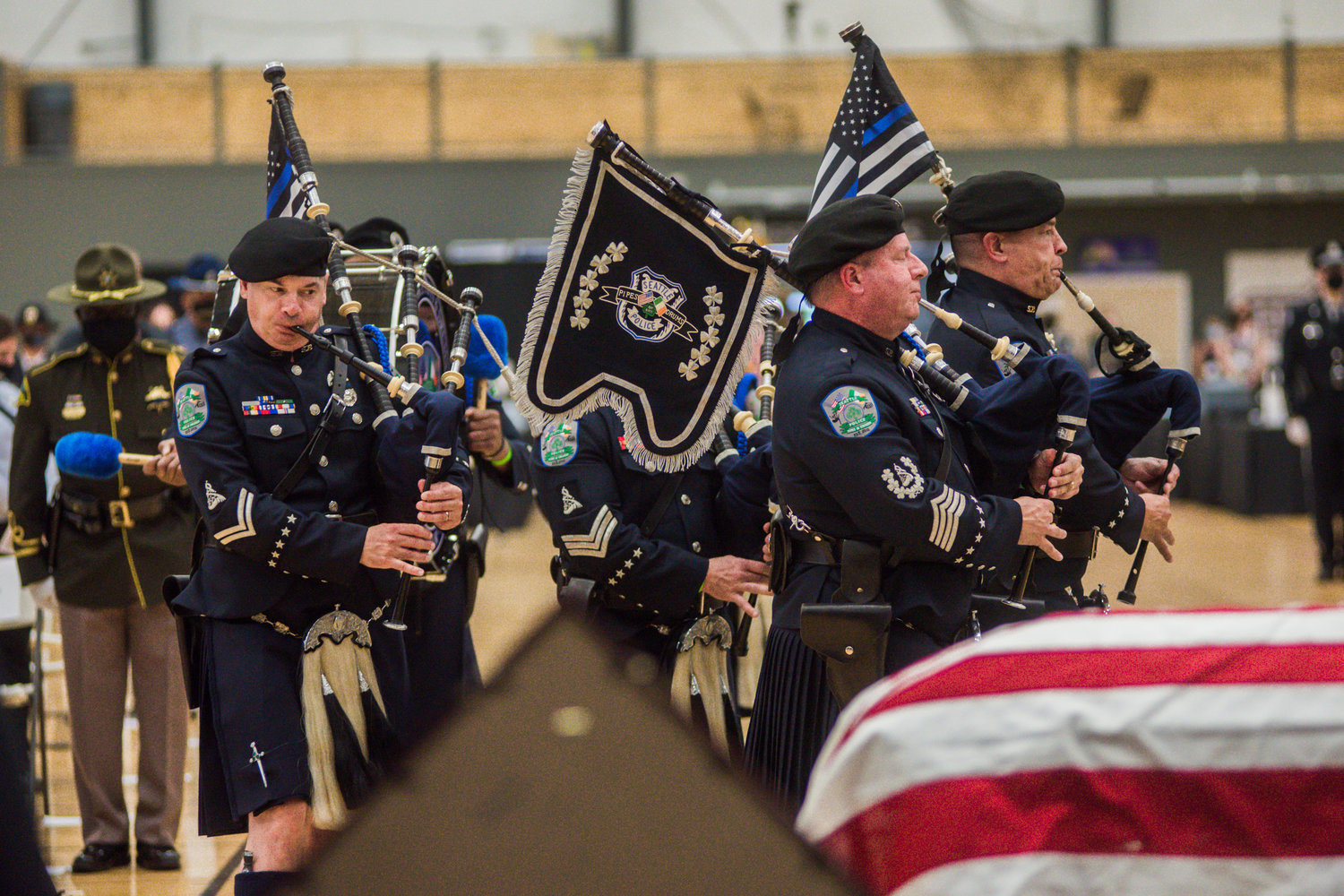 Bagpipers with the Seattle Police Pipes and Drums play during a service to honor fallen trooper Justin R. Schaffer Wednesday afternoon in Centralia.
