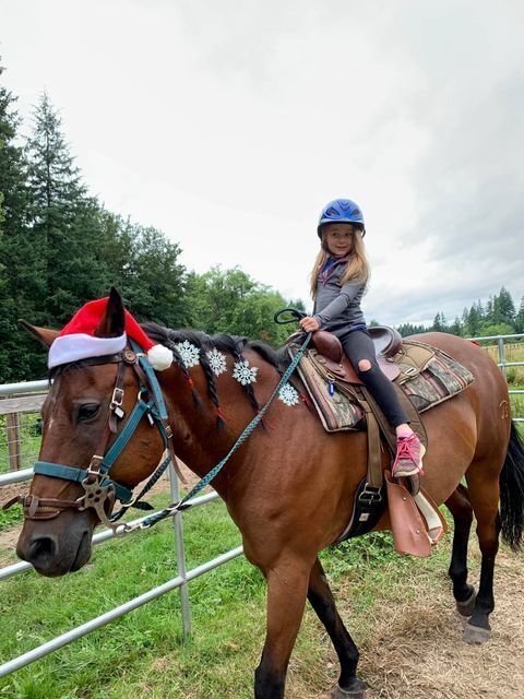 Adelaide Tait rides and celebrates Christmas in July with her horse Jim.