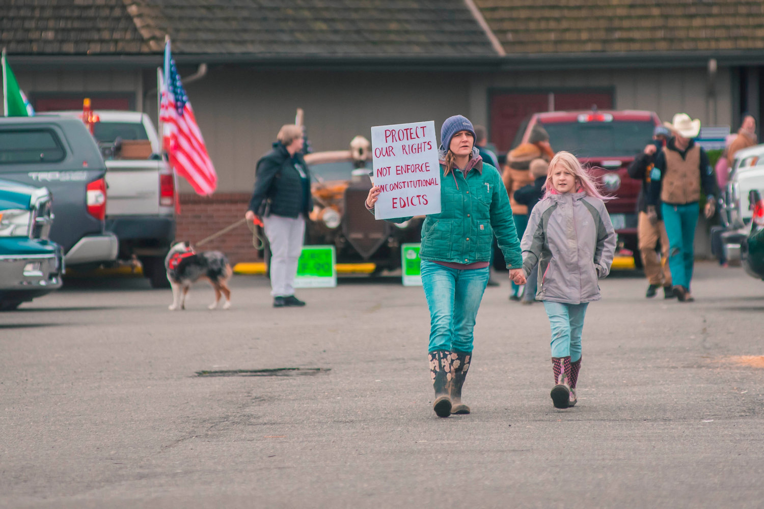 ‘Peaceful Protesters’ stand outside of Spiffy’s Restaurant in South Chehalis as they continue to host indoor eating on Thursday.