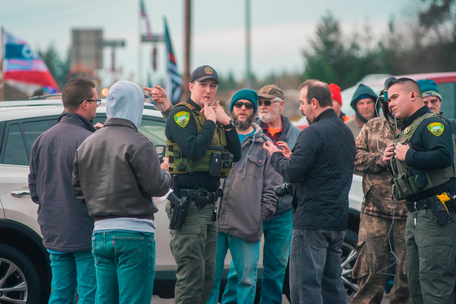 Lewis County Sheriff Deputies respond to a call at Spiffy’s after a car peeled out of the parking lot while surrounded by a group of ‘peaceful protesters’ on Thursday in South Chehalis.