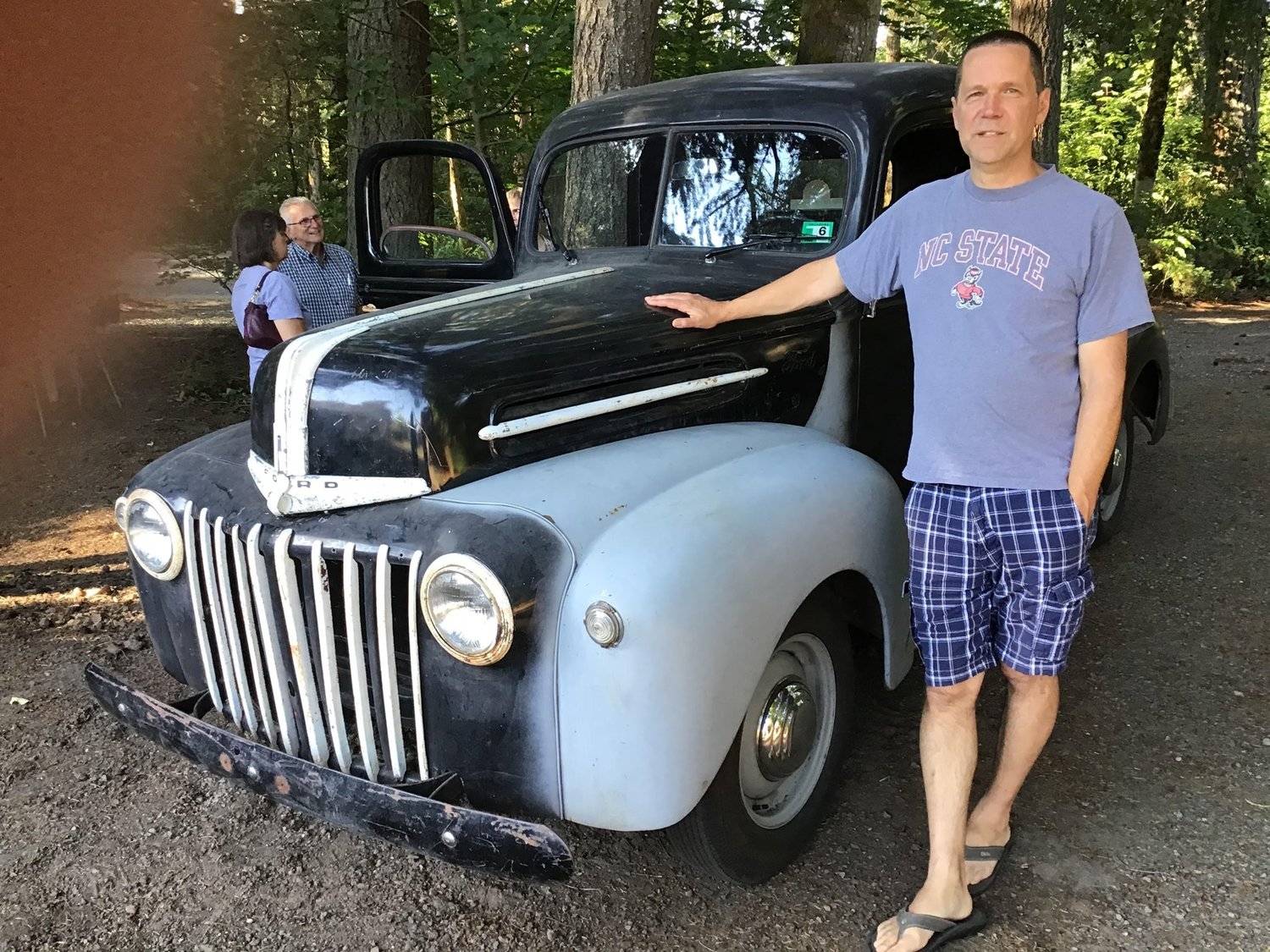 Dave Elson stands with his truck, a 1942 Ford. The body design of the Ford Truck model was revamped after World War II in 1947.