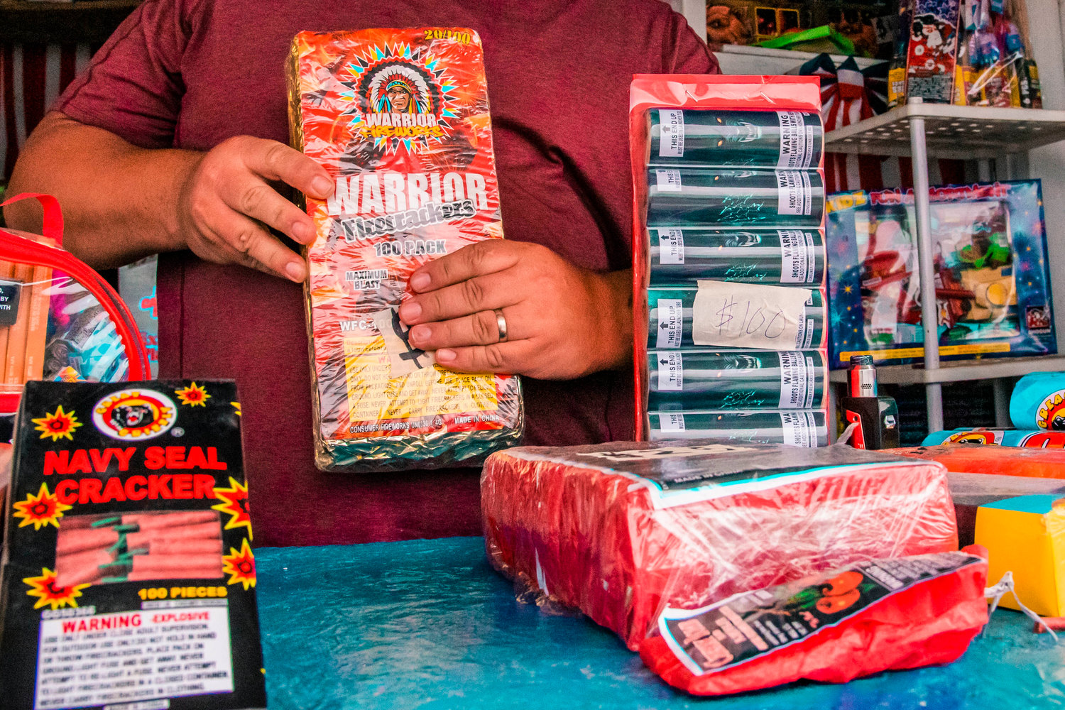 A brick of firecrackers are held by a fireworks vendor in this file photo.