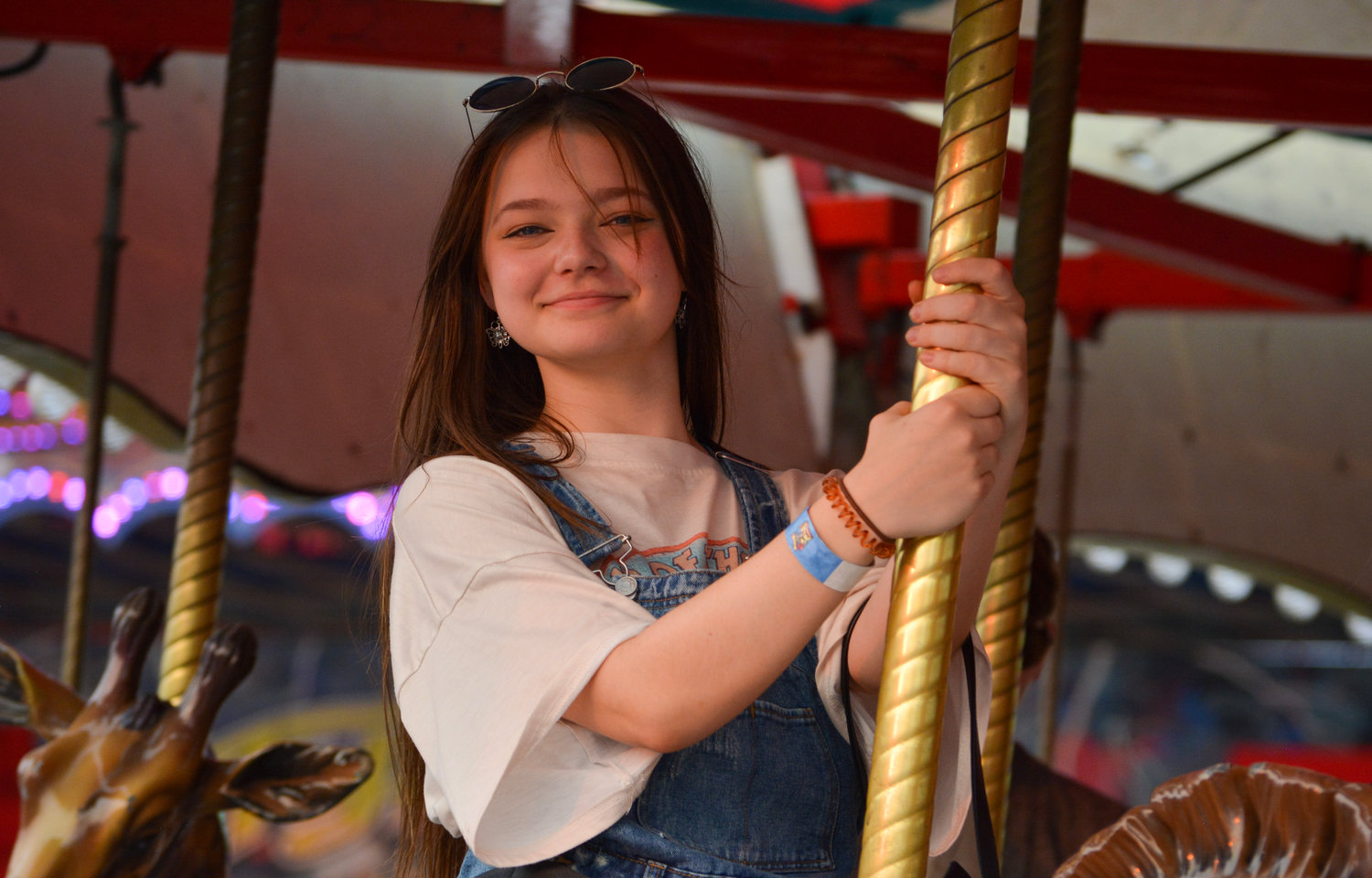 Rylie Edwards, a Clark County resident, rides the carousel with friends on Aug. 13 at the Clark County Event Center at the Fairgrounds.