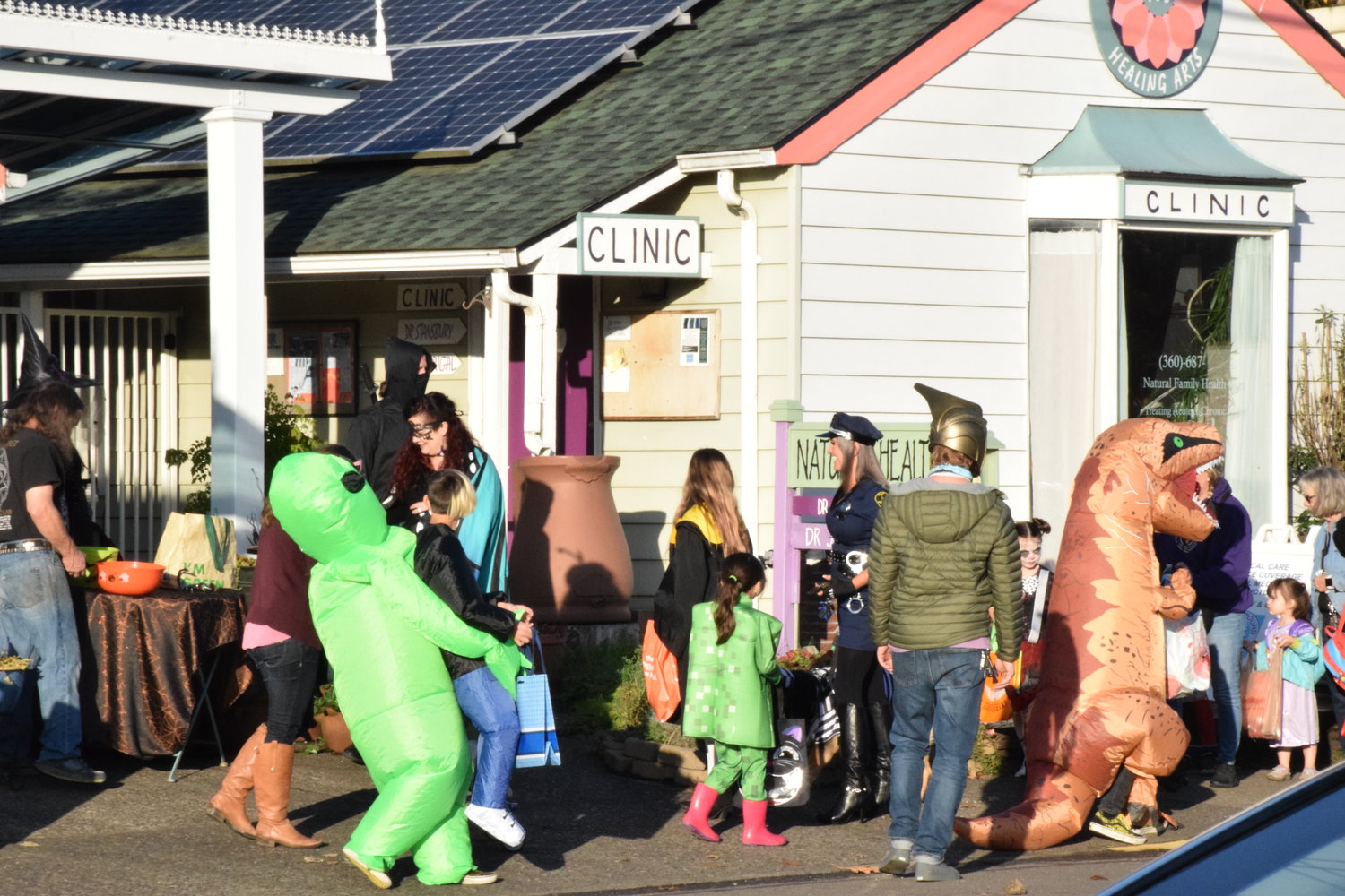 Trick-or-treaters saunter along Battle Ground’s Main Street during the city’s annual Halloween event on Oct. 29.