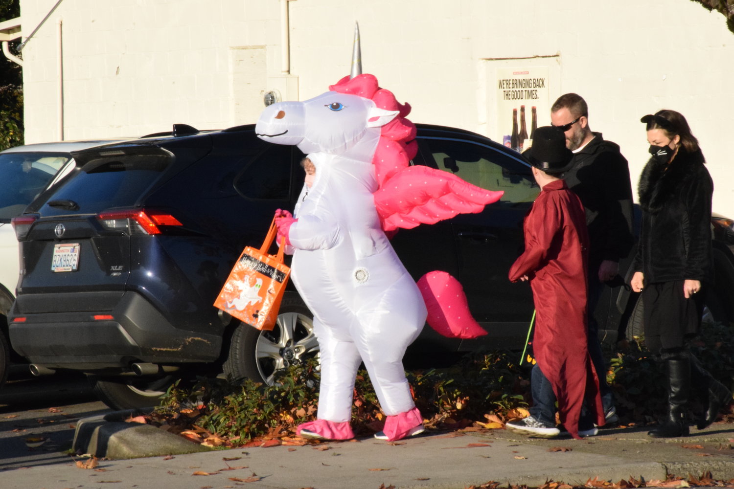 A unicorn heads down Main Street in Battle Ground during the city’s annual Halloween event on Oct. 29.