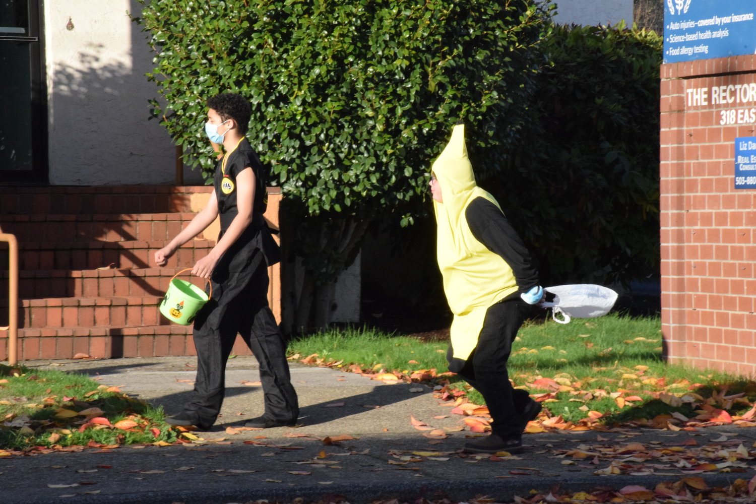 A martial artist and anthropomorphic banana head to the next business located on Main Street during the city’s annual Halloween event on Oct. 29.