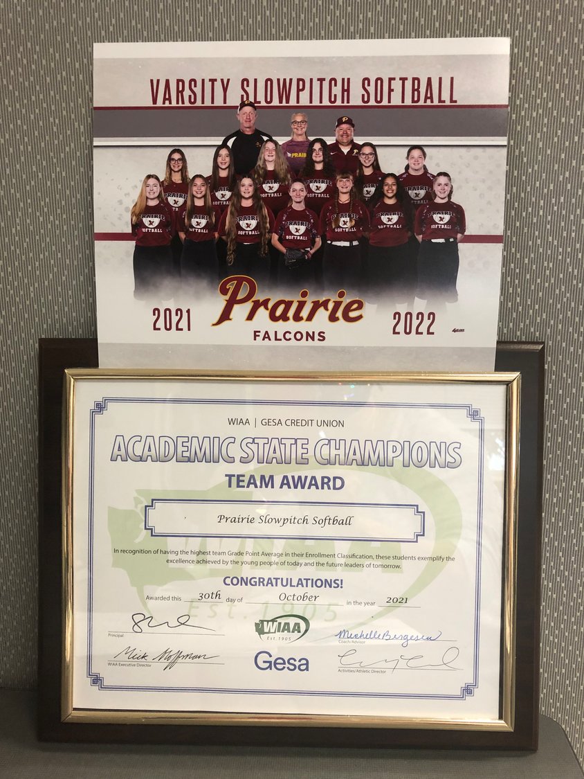 The Prairie Falcons slowpitch softball team is pictured with the 3A academic title they won.