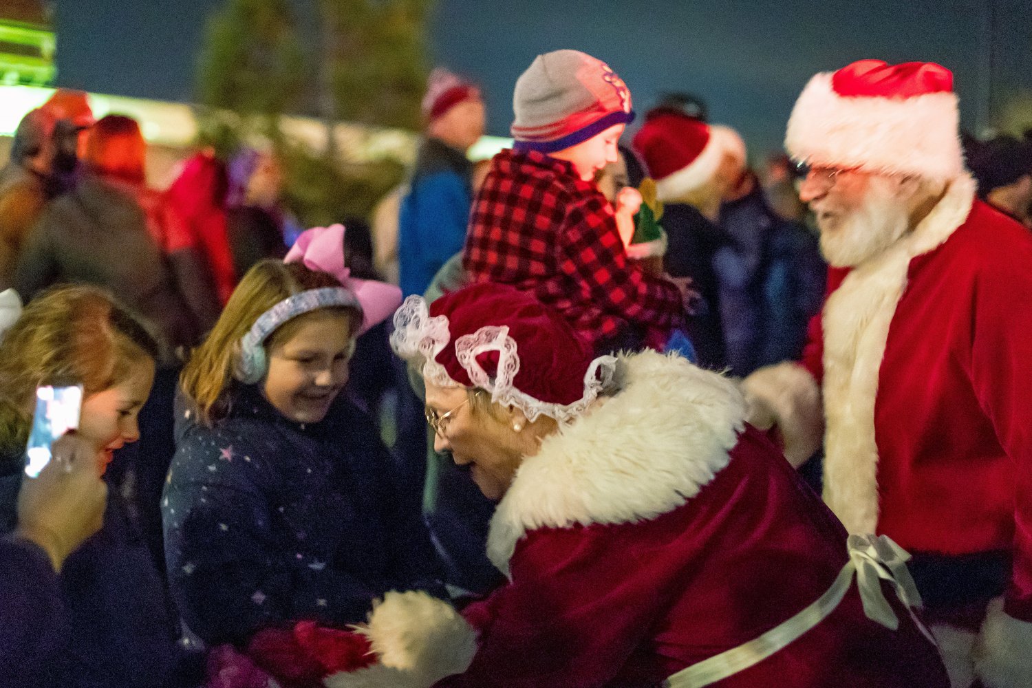 A family meets Santa and Mrs. Claus at a previous holiday tree lighting event in Battle Ground.