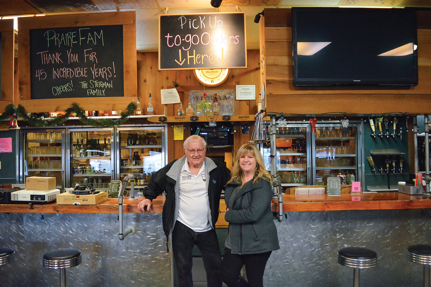 Ron Steigman, Prairie Bar and Grill’s former owner, and Shawna Risner, the new owner, are pictured.