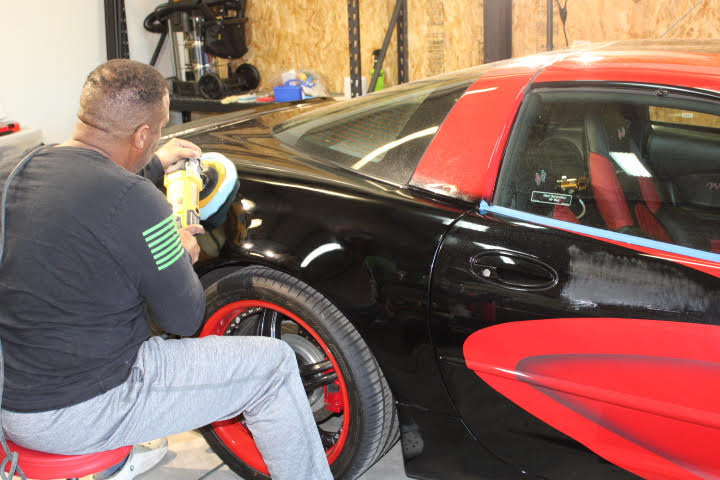 Irving Duffy Jr., the co-owner of A Better Shine Auto Detailing and Ceramics, shines a car.