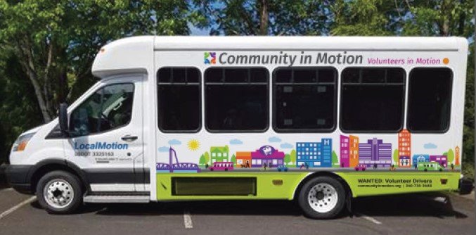 Community in Motion’s minibus is pictured.
