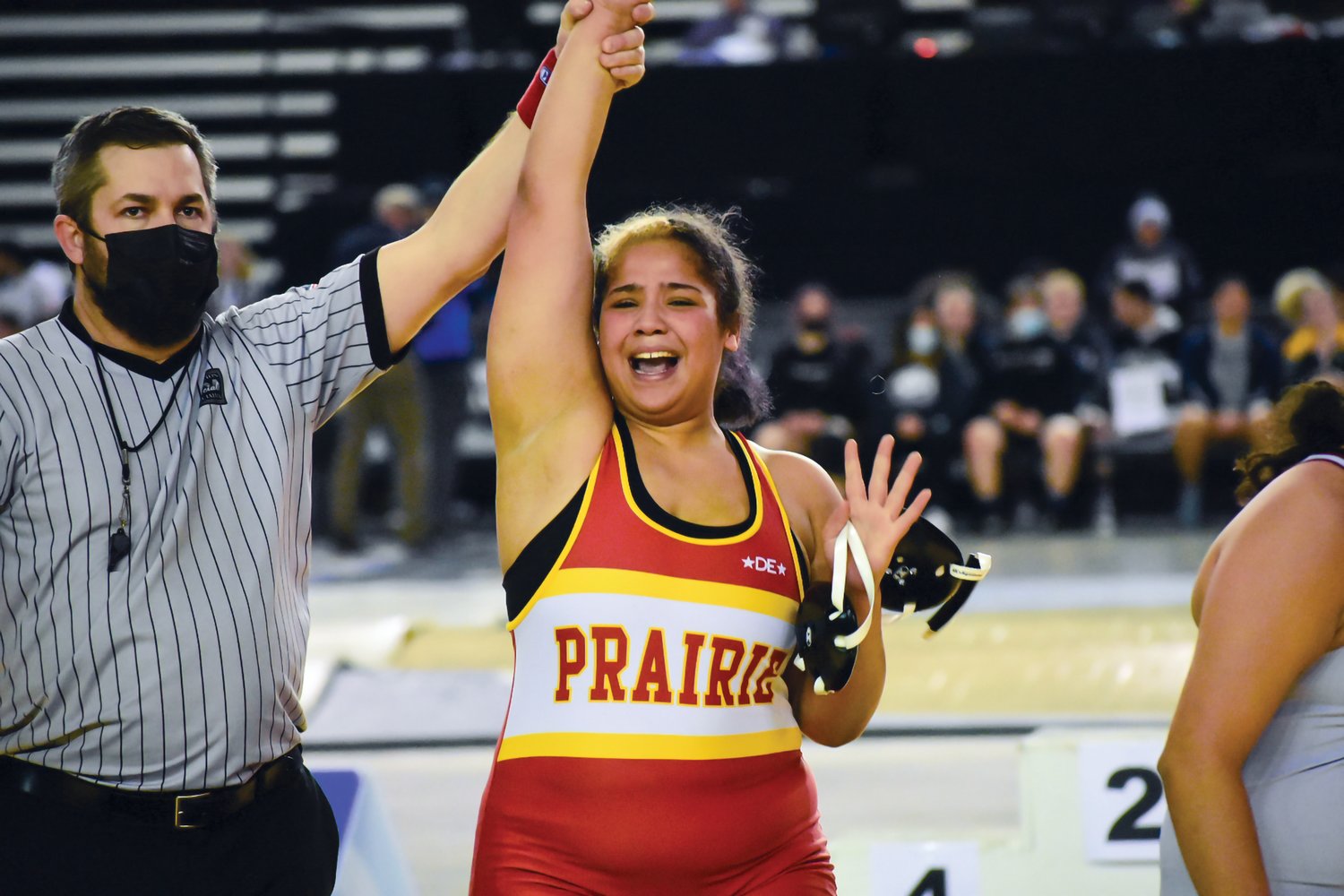 Prairie High School freshman Faith Tarrant celebrates her victory after she placed first at the Mat Classic in Tacoma. Tarrant is the first girl wrestler from Prairie High School to win a state championship in wrestling. Prairie High School senior Alex Ford also won the state championship in the boys 3A 160-pound division, as a handful of other local wrestlers placed at the tournament.