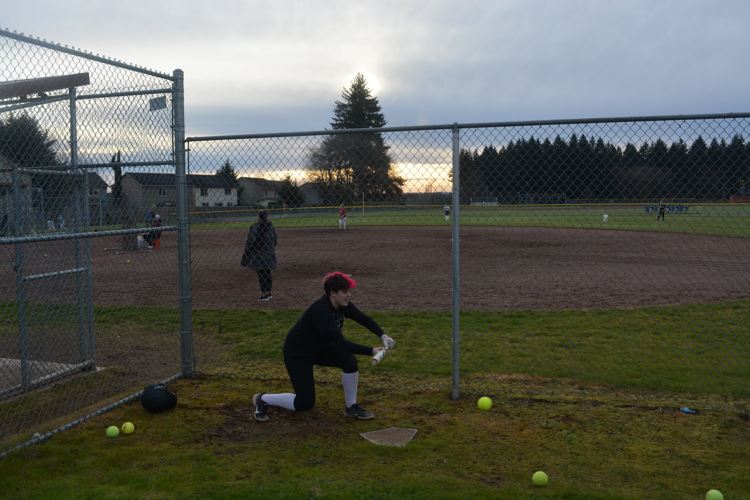 Alysia Fraly practices her bunting skills at Prairie High School on Thursday, March 10.
