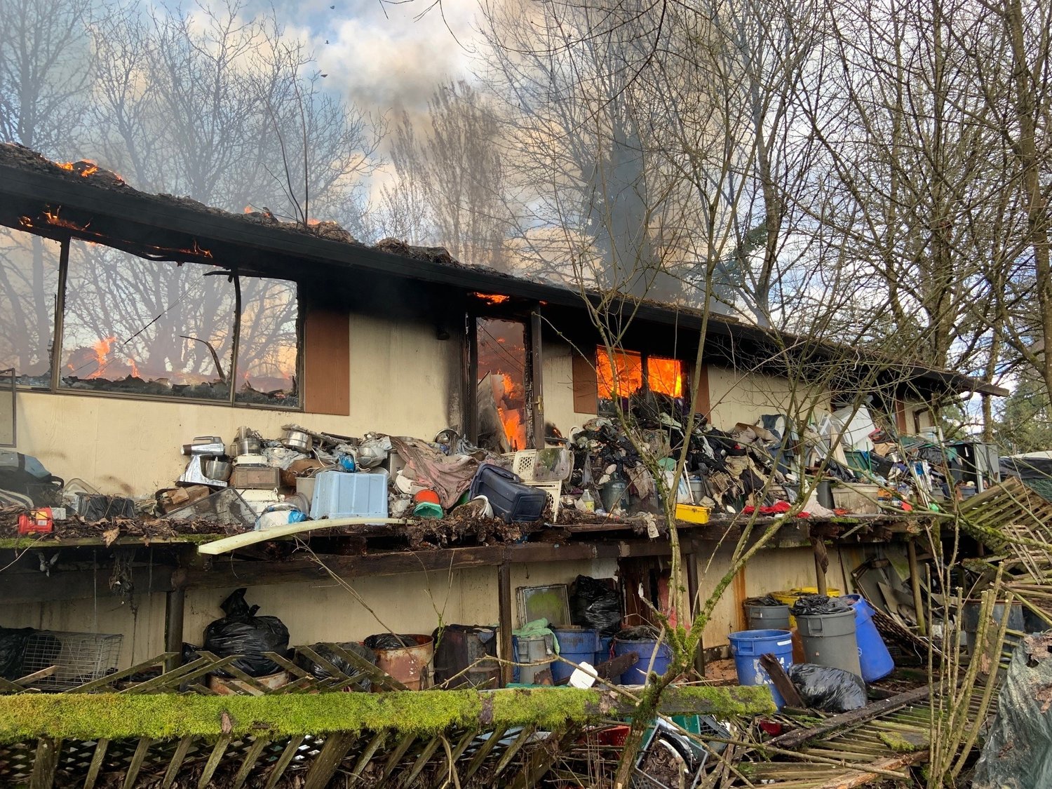 Clutter is pictured on a collapsing deck at the site of a house fire in the Cherry Grove area on March 16.