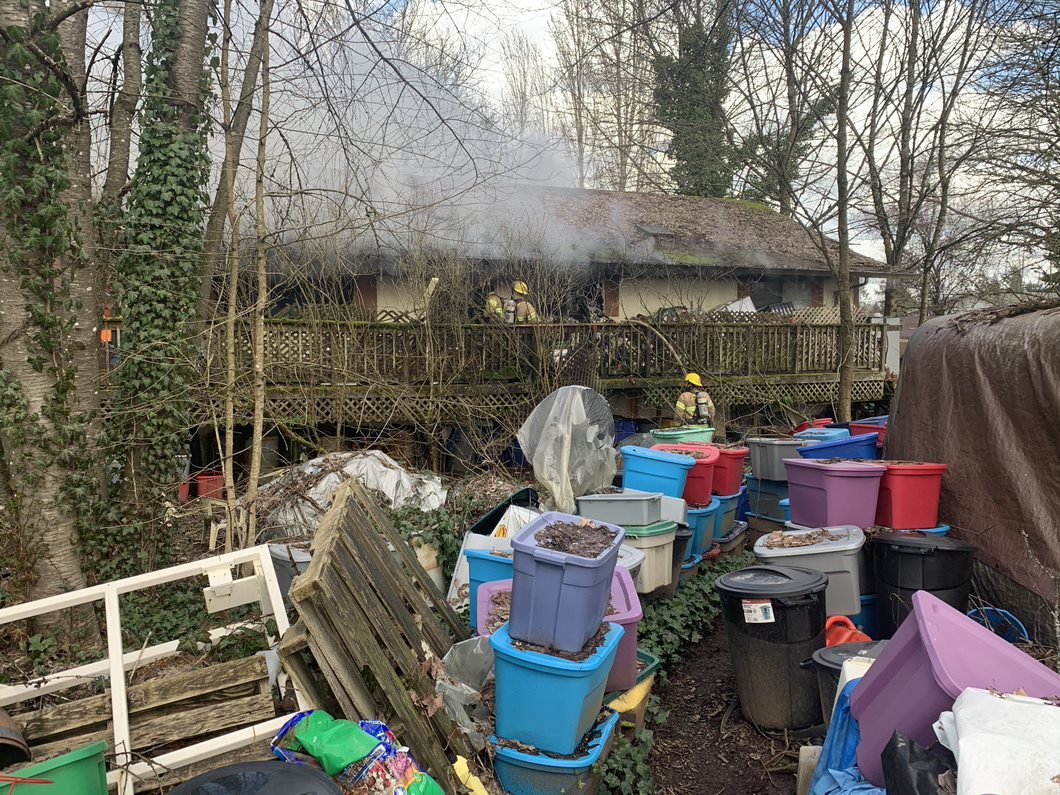 Clutter is pictured in the yard of a house that caught fire at 8710 NE 244th St. on March 16. 