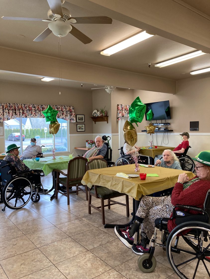 The seniors at Woodland Care Center enjoy their St. Patrick’s Day Celebration on March 17, complete with green decorations and food.