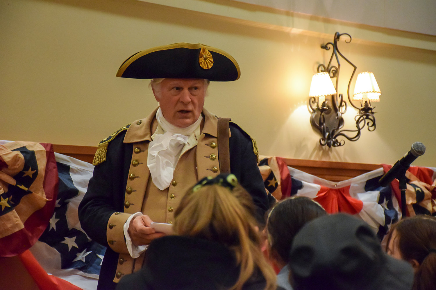 George Washington reenactor Vern Frykholm speaks to Tukes Valley Middle School students during the Sons of the American Revolution convention at the Heathman Lodge on April 9.