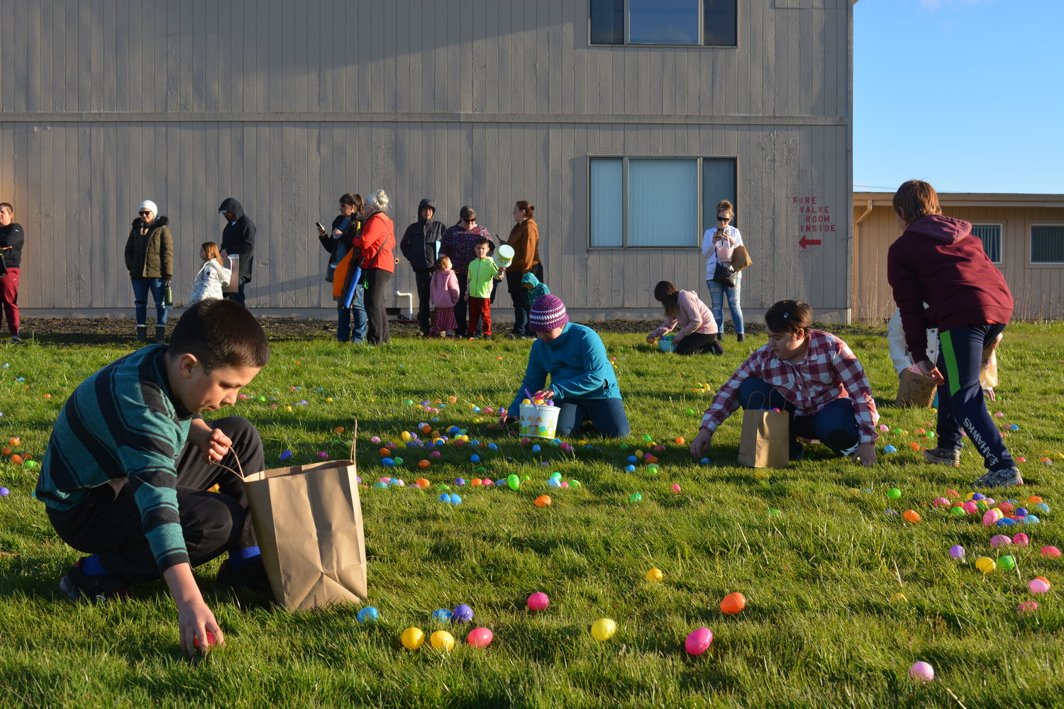 The 9- to 12-year-old group collects eggs during an Easter egg hunt at Mountain View Christian Center on April 13.