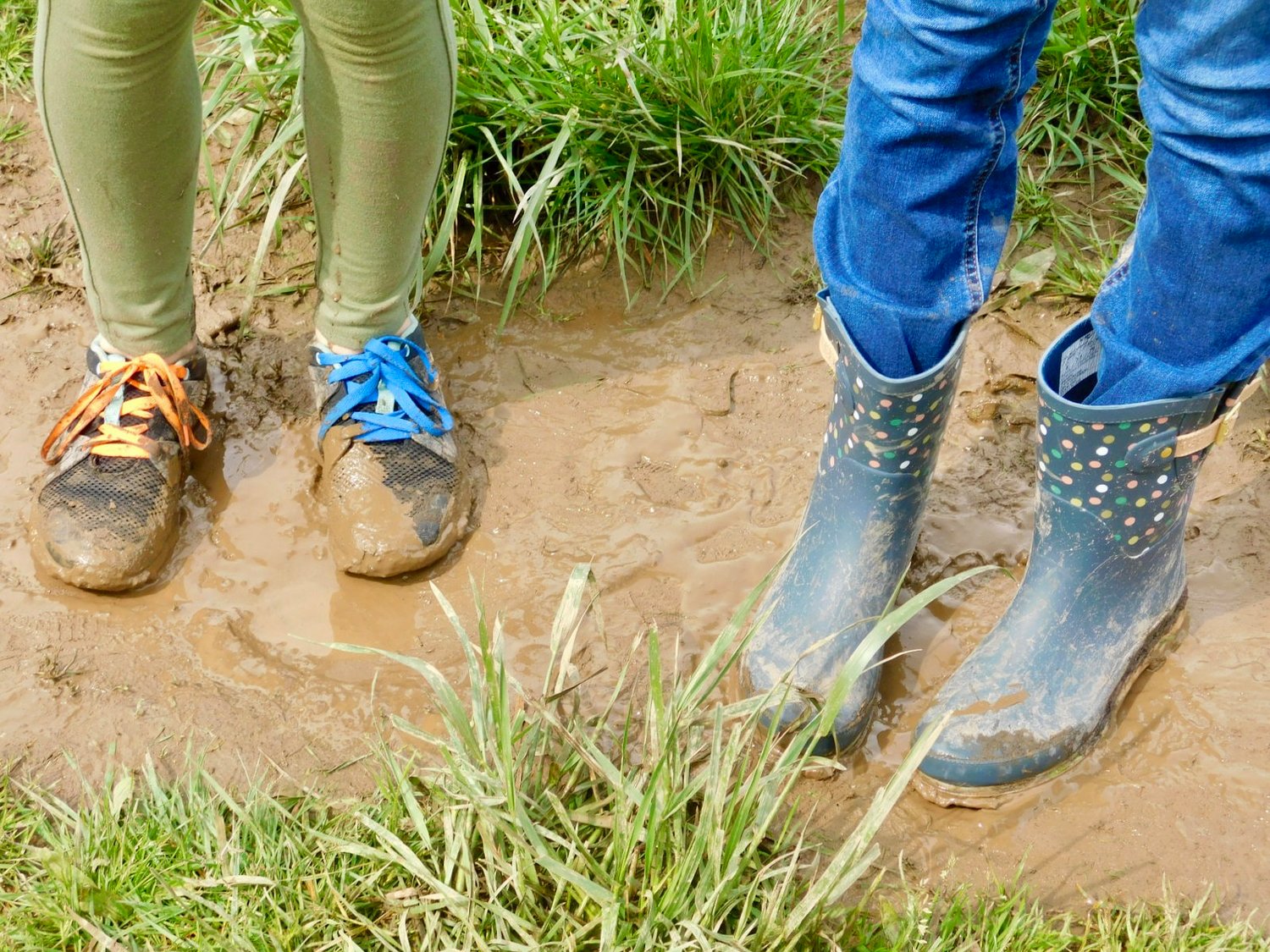 Two kids with muddy shoes are pictured at the Mini-Cispus program at Whipple Creek Regional Park.
