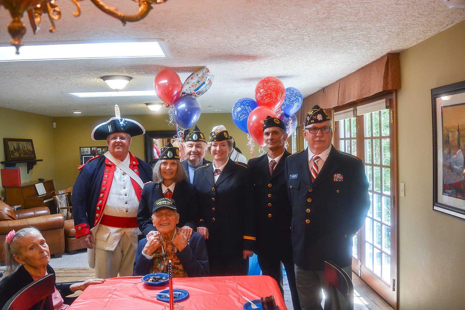 William “Lucky” Mullins was surrounded by his fellow members of the Ridgefield American Legion Post 44 during his birthday party in Vancouver on May 4.