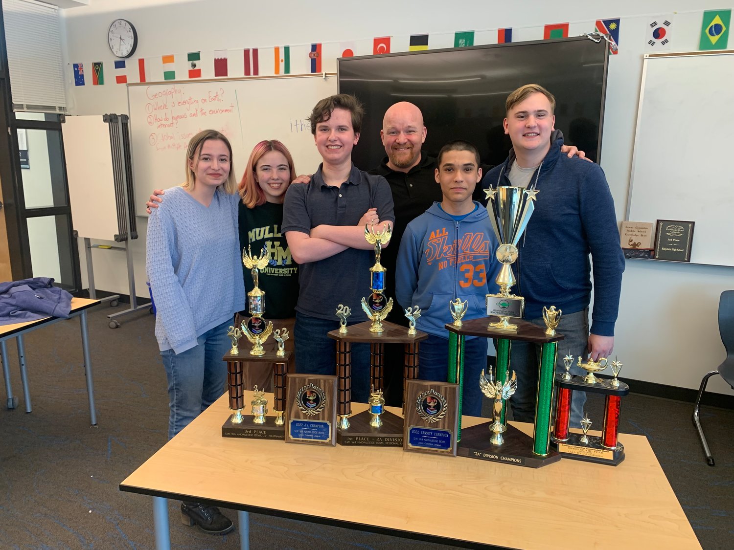 From left to right, Ridgefield High School National Knowledge Bowl champions Emiliana Newell, Olivia DesRochers, Adam Ford, coach David Jacobson, James Haddix, and captain Micah Ross.