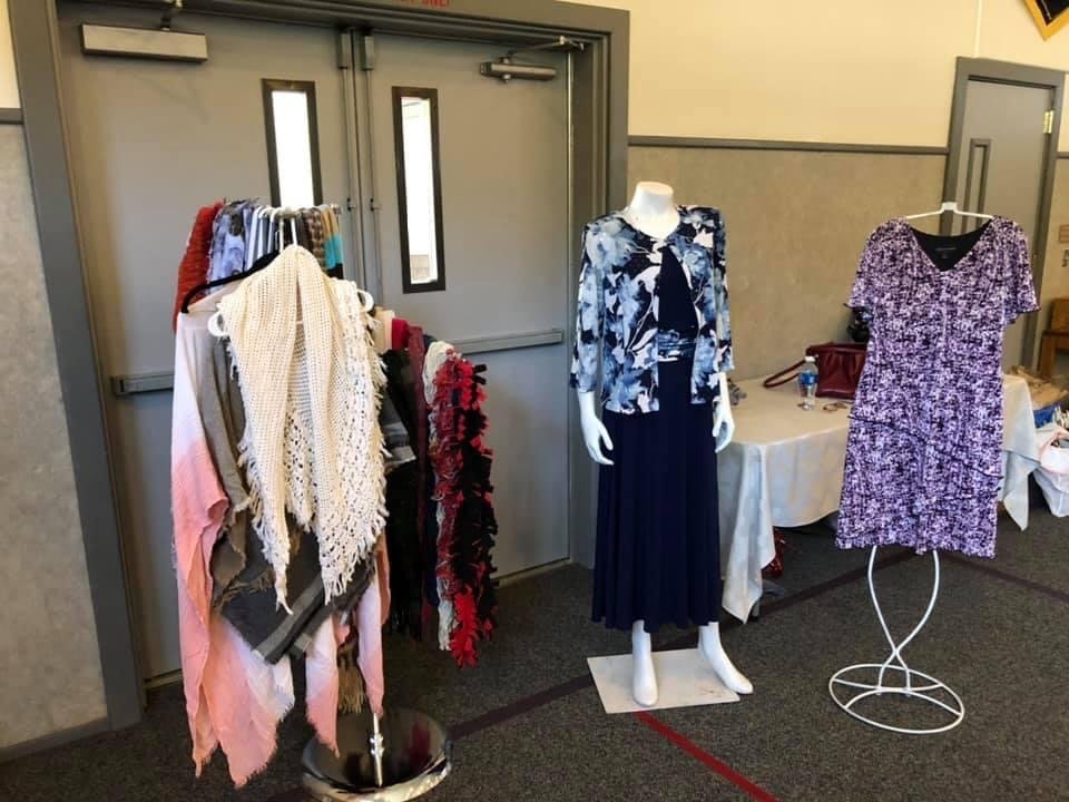 A number of clothes are displayed at a previous clothing drive inside of the Yacolt Community Church.