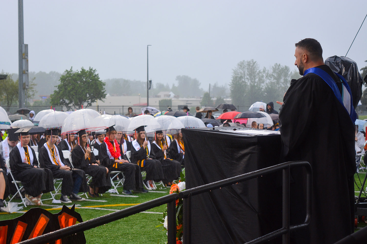Battle Ground High School Principal Charbonneau Gourde delivers a speech to his students at the Class of 2022 graduation ceremony on June 10.