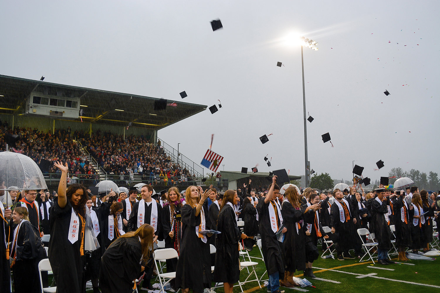 Battle Ground High School’s Class of 2022 tosses their graduation caps in the air before saying goodbye at their graduation ceremony in Battle Ground on June 10.