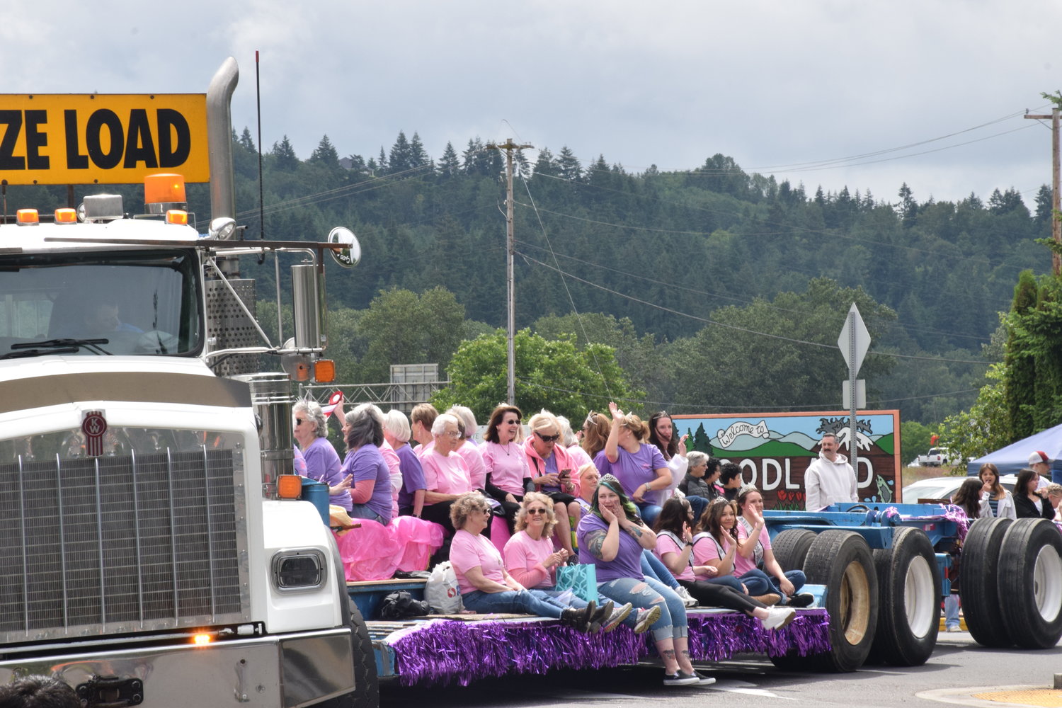 Past members of Woodland Planters Days royalty wave from the bed of a truck during the celebration’s 100th-year parade on June 18.