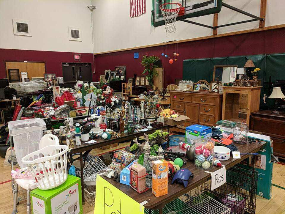 A number of items ranging from pet products to furniture are displayed at a previous rummage sale at Firm Foundation Christian School in Battle Ground.