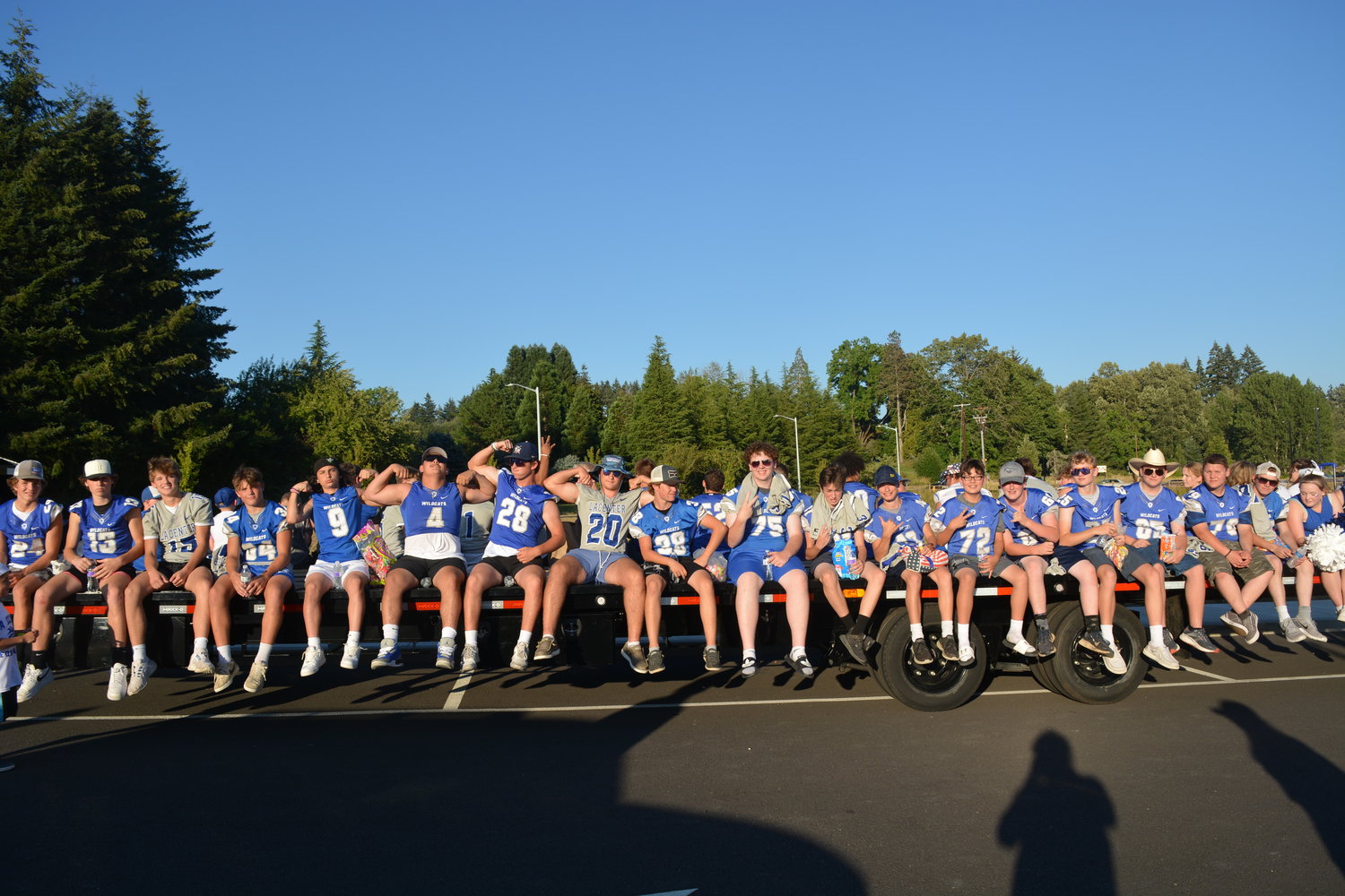 The La Center Wildcats football team poses for a photo before participating in the La Center Our Days parade on July 29.