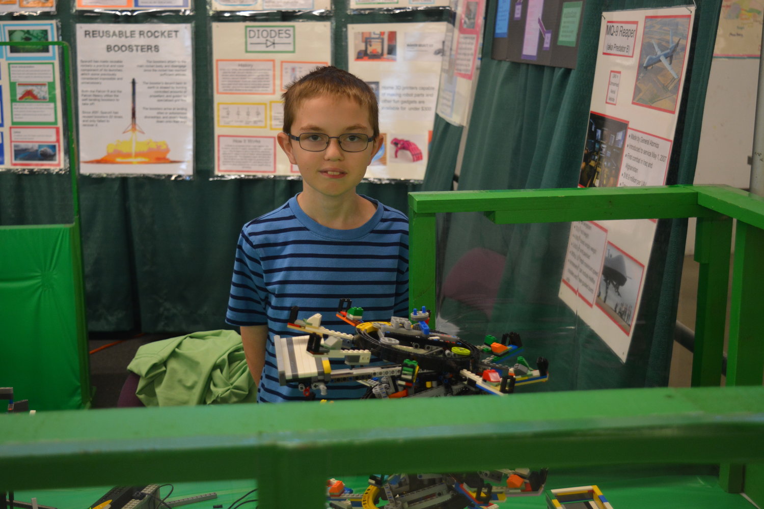 CJ Lindell showcases one of his creations he made for the 4-H robotics program at the Clark County Fair on Aug. 5.