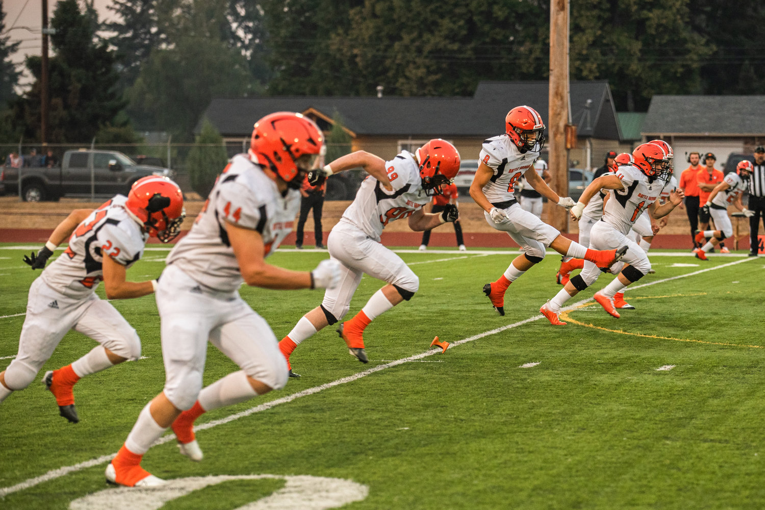 Battle Ground Tigers kick the football and prepare to run up the field on Friday night during an away game in Centralia.