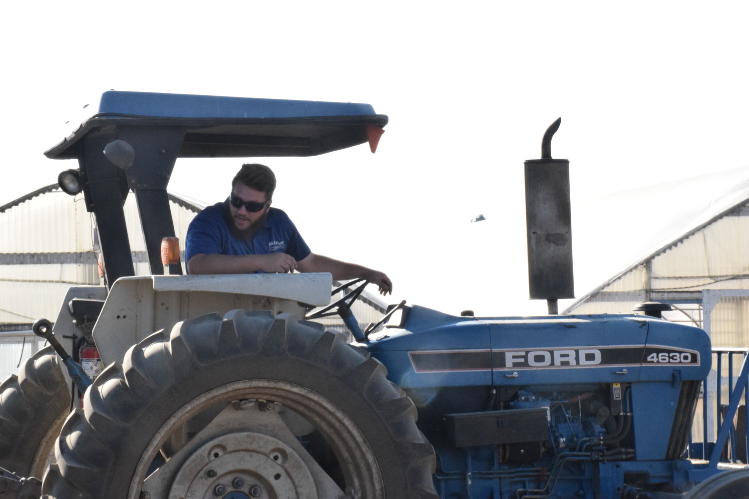 Cameron LaFrenz prepares to head off in a tractor-pulled hayride at Bi-Zi Farms on Sept. 9.