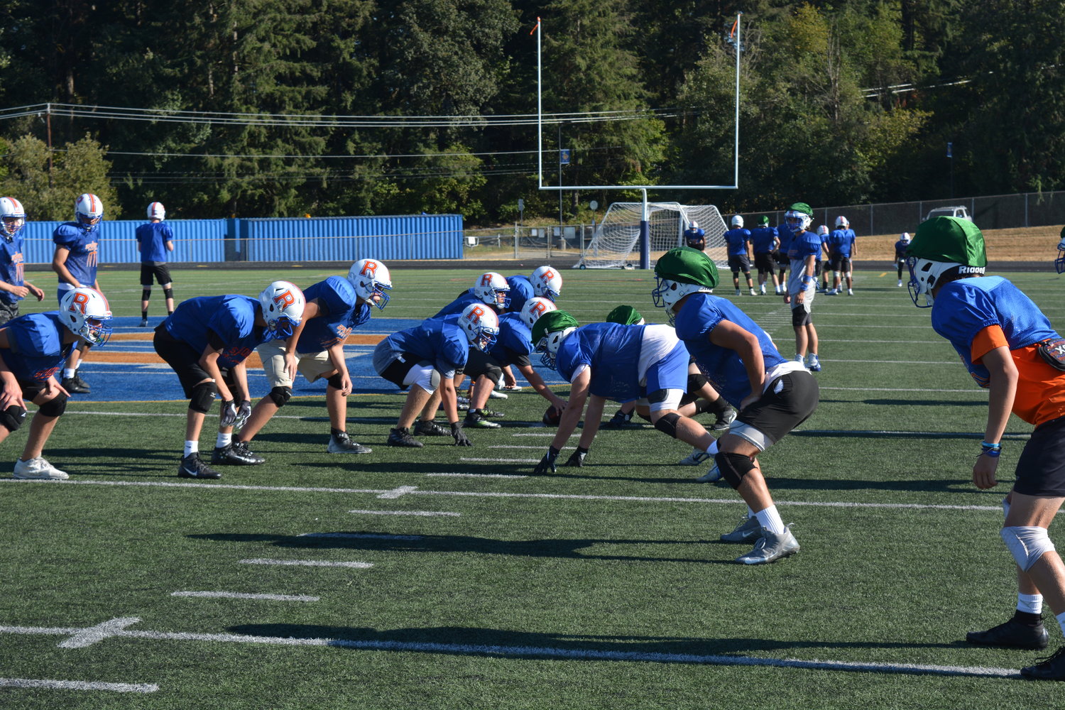 The Ridgefield Spudders get into position during practice at Ridgefield High School on Sept. 6.