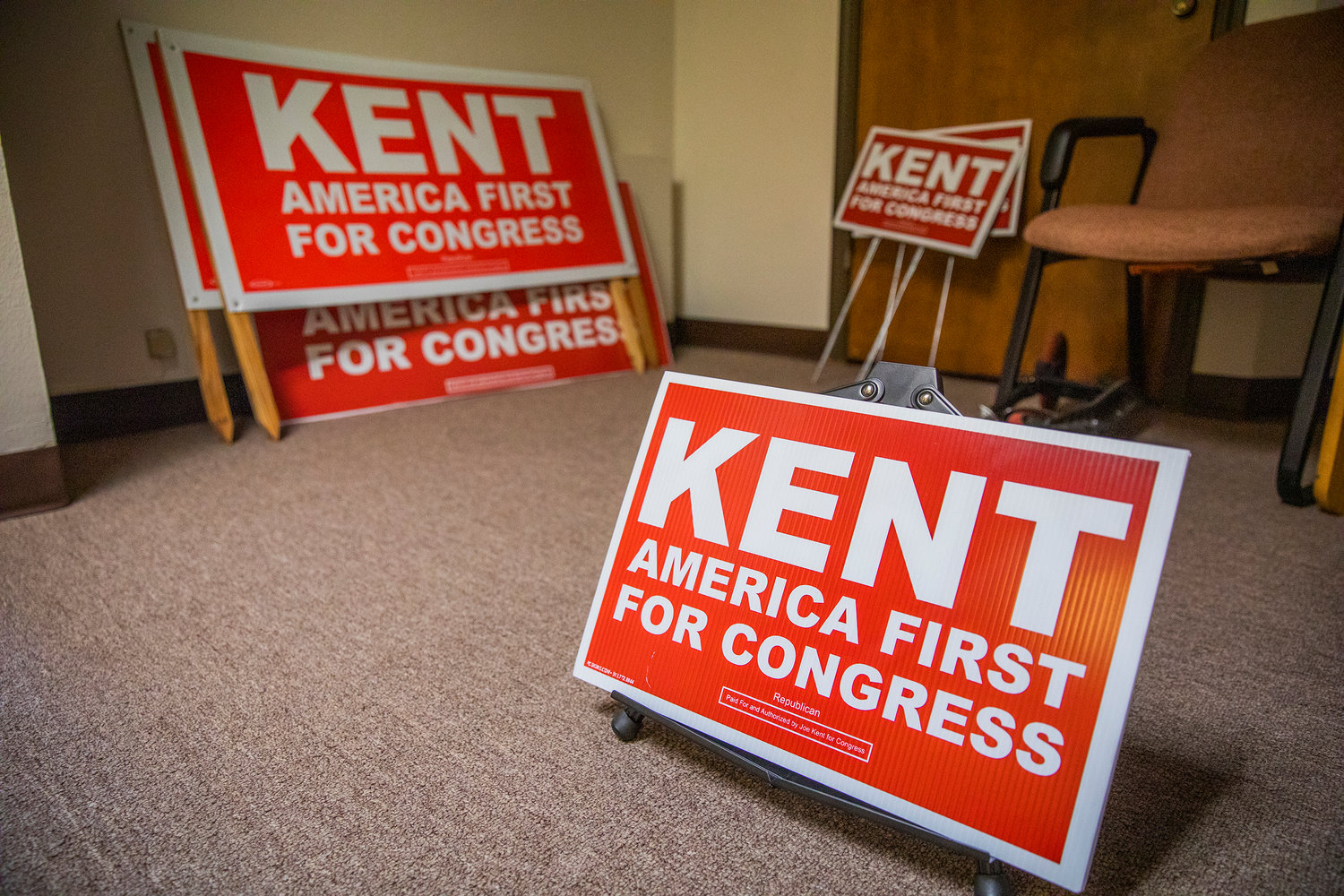 Signage for candidate Joe Kent sits on display in a Vancouver office building on Thursday, Sept. 8, 2022.