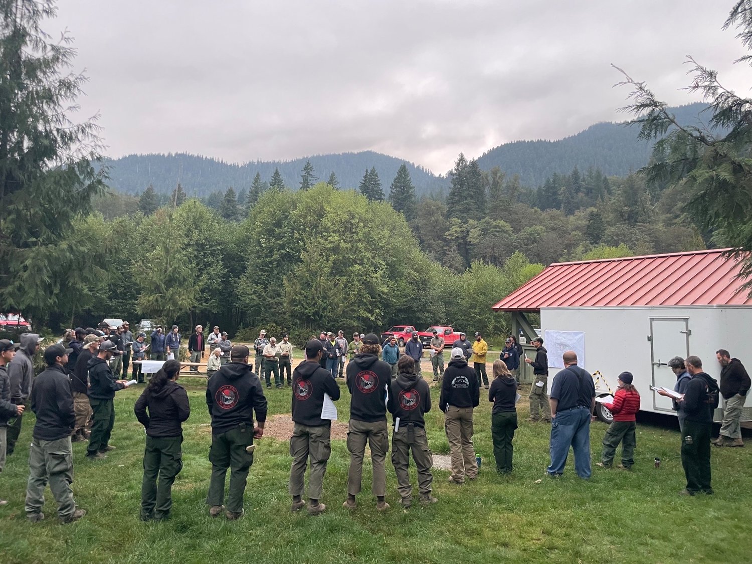 Firefighters working the Kalama fire in the Gifford Pinchot National Forest receive a briefing on Sept. 14.
