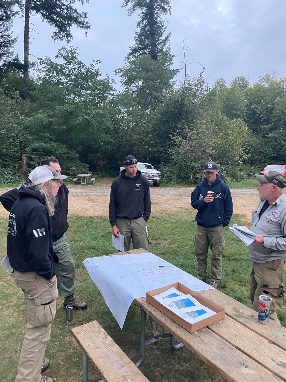 Firefighters working the Kalama fire in the Gifford Pinchot National Forest receive a briefing on Sept. 14.