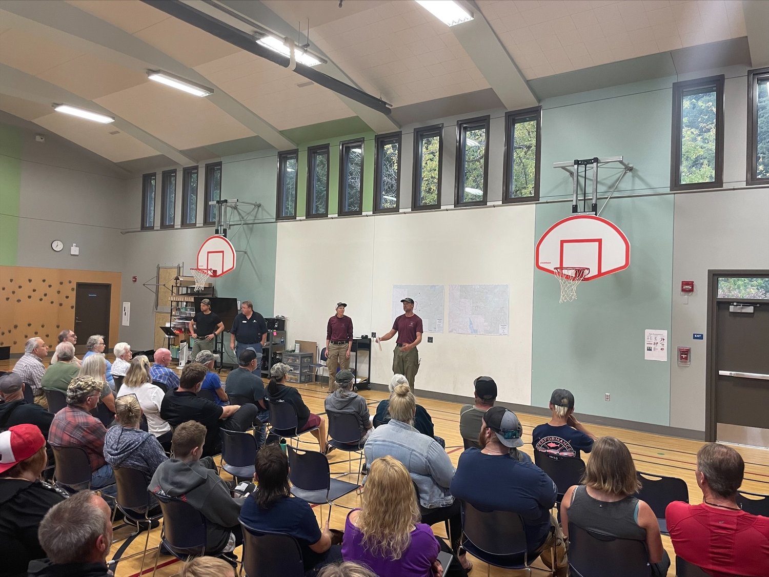 Community members hear from firefighters working the Kalama fire in the Gifford Pinchot National Forest at Yale Elementary School on Sept. 12.