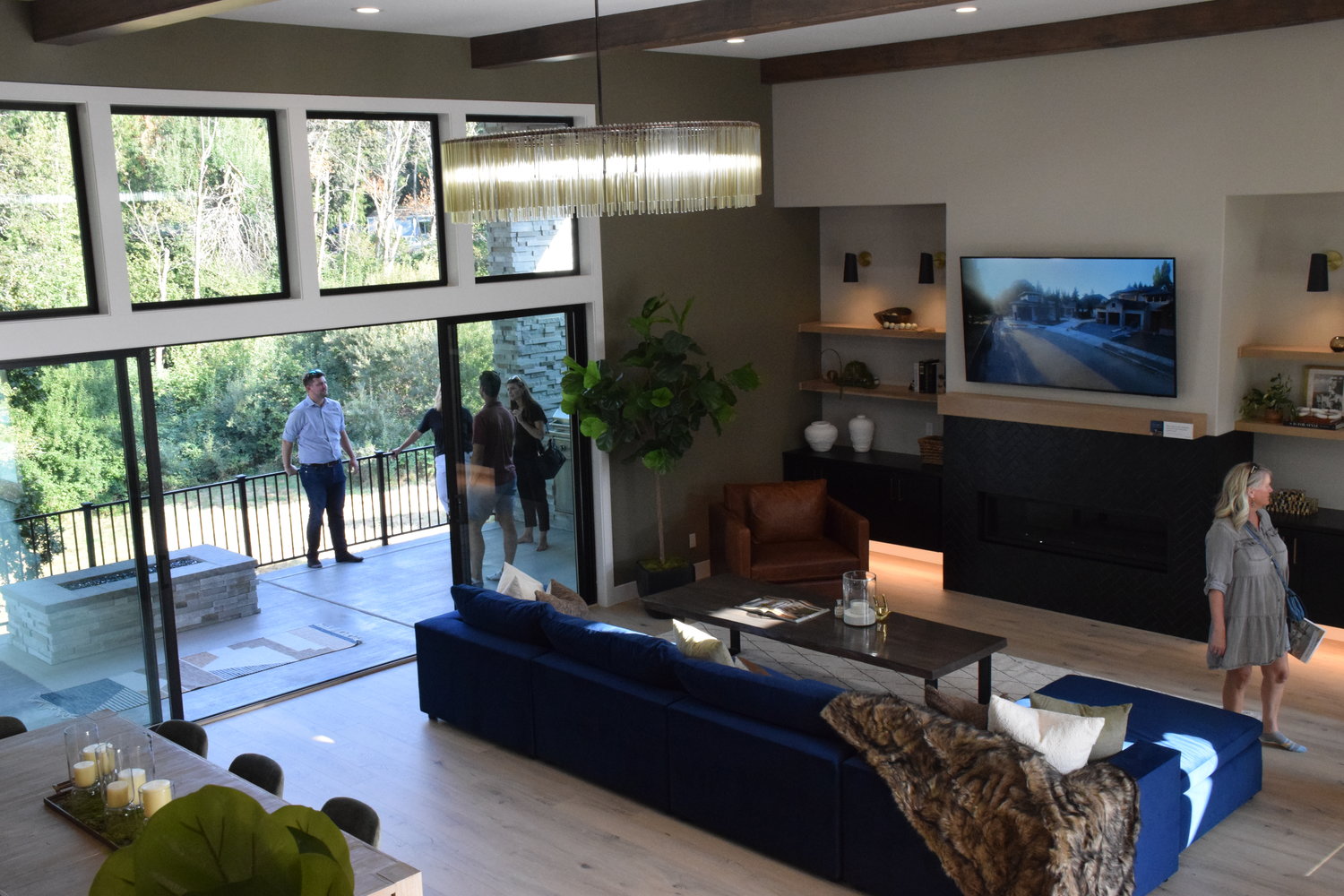 Attendees of the 2022 Parade of Homes mill about the “Oak View,” one of six homes on display at this year’s festivities located in Ridgefield.