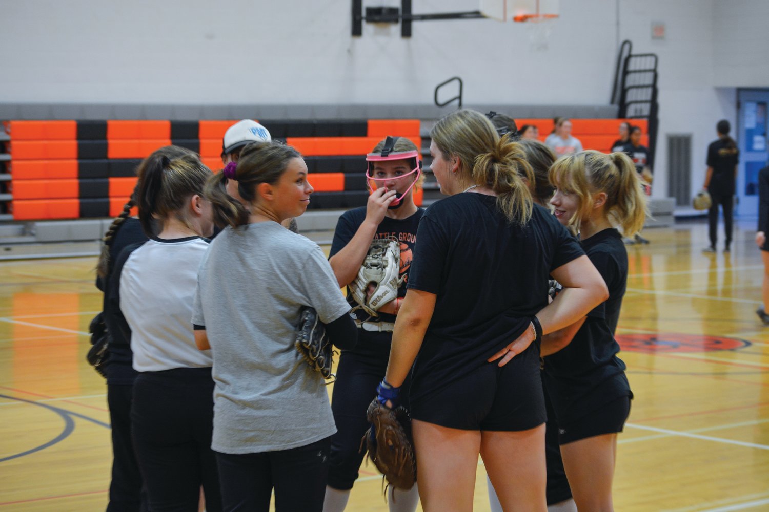The Battle Ground High School girls softball team huddles together during practice on Oct. 20.