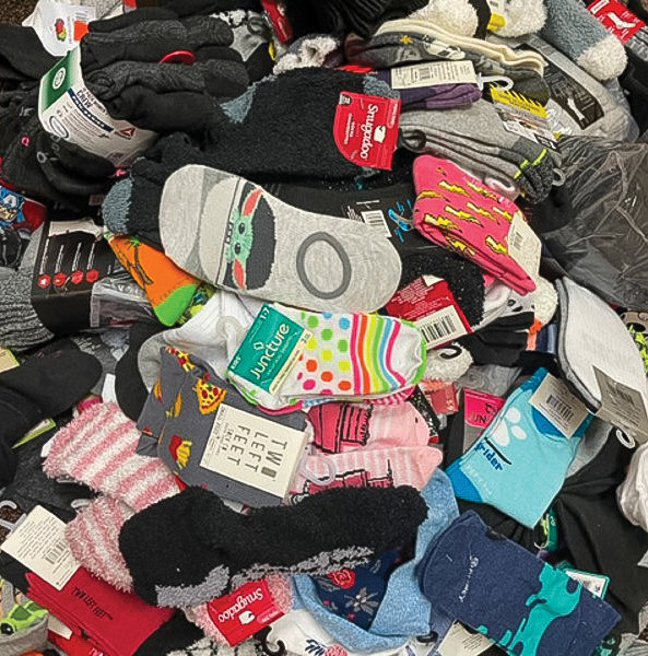 A pile of socks collected at Pleasant Valley Primary School is displayed.