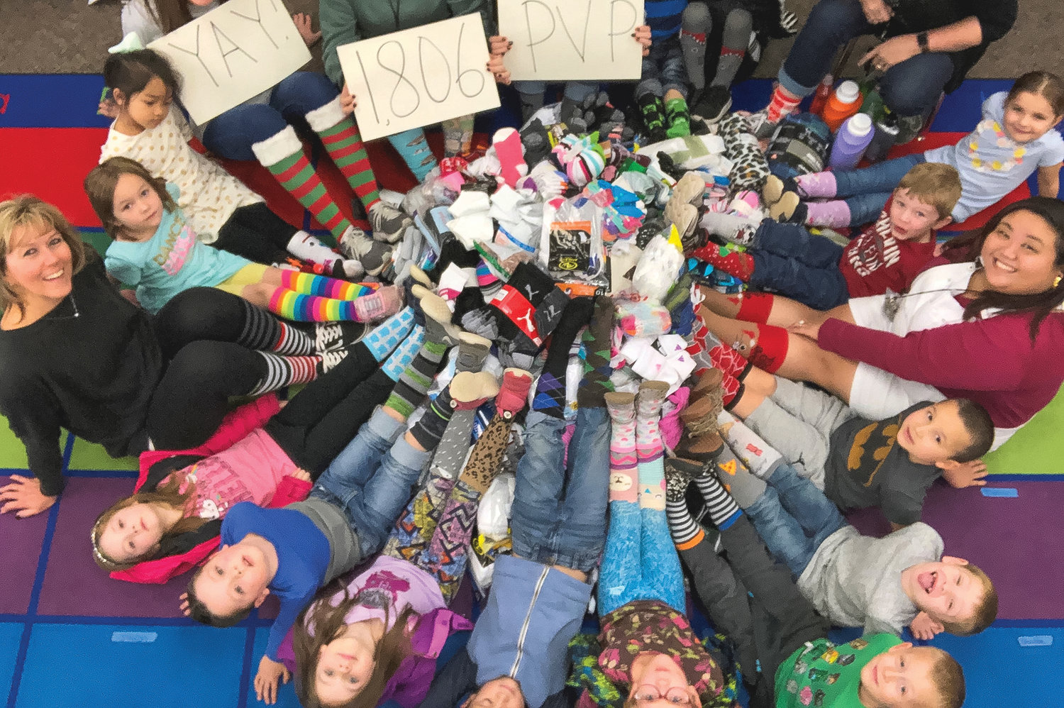 Michelle Anderson’s kindergarten class show socks they 
donated at a previous Socktober event in 2019.