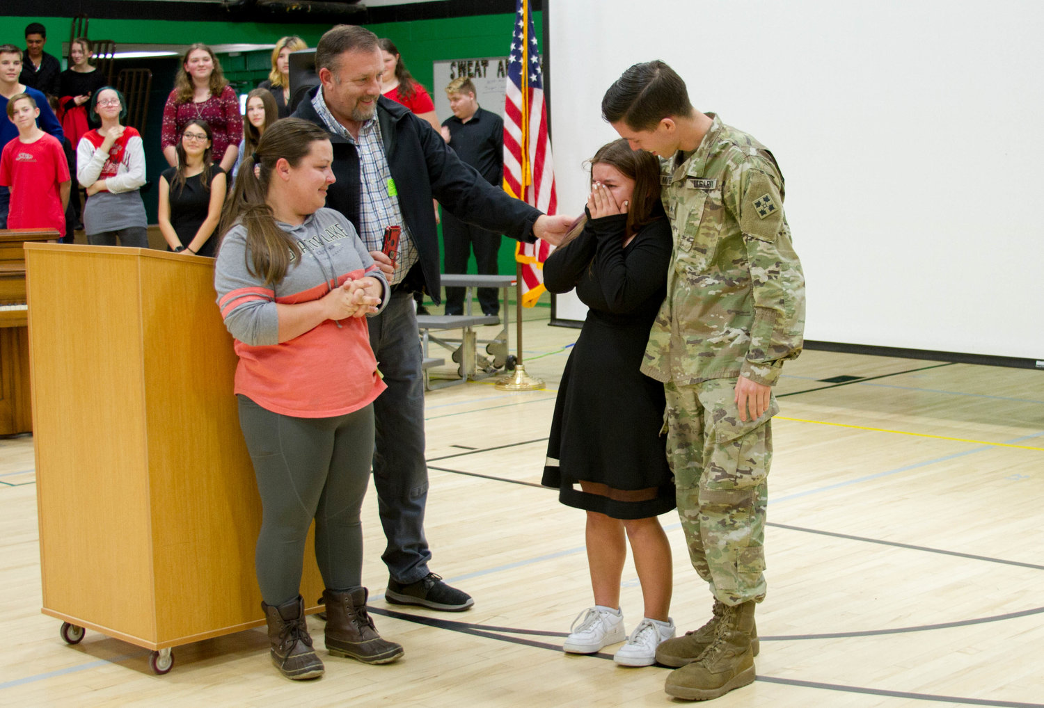 Abigail Alway, an eighth grader at Woodland Middle School, was surprised during the school’s Veterans Day assembly with the return of her uncle, Sergeant Edward Mayer II, who helped raise her.