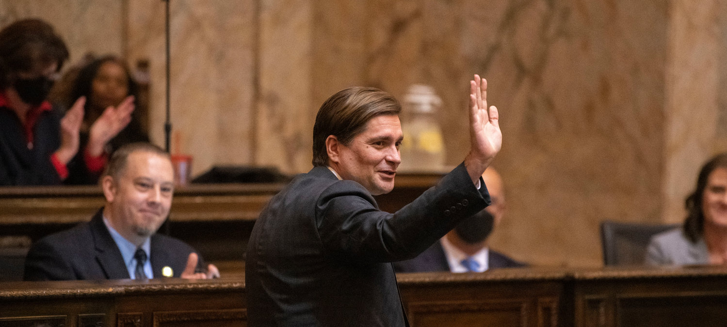 Treasurer Mike Pellicciotti stands to be recognized prior to the beginning of the 2023 State of the State speech during the first in-person session since 2020 Tuesday afternoon in Olympia.