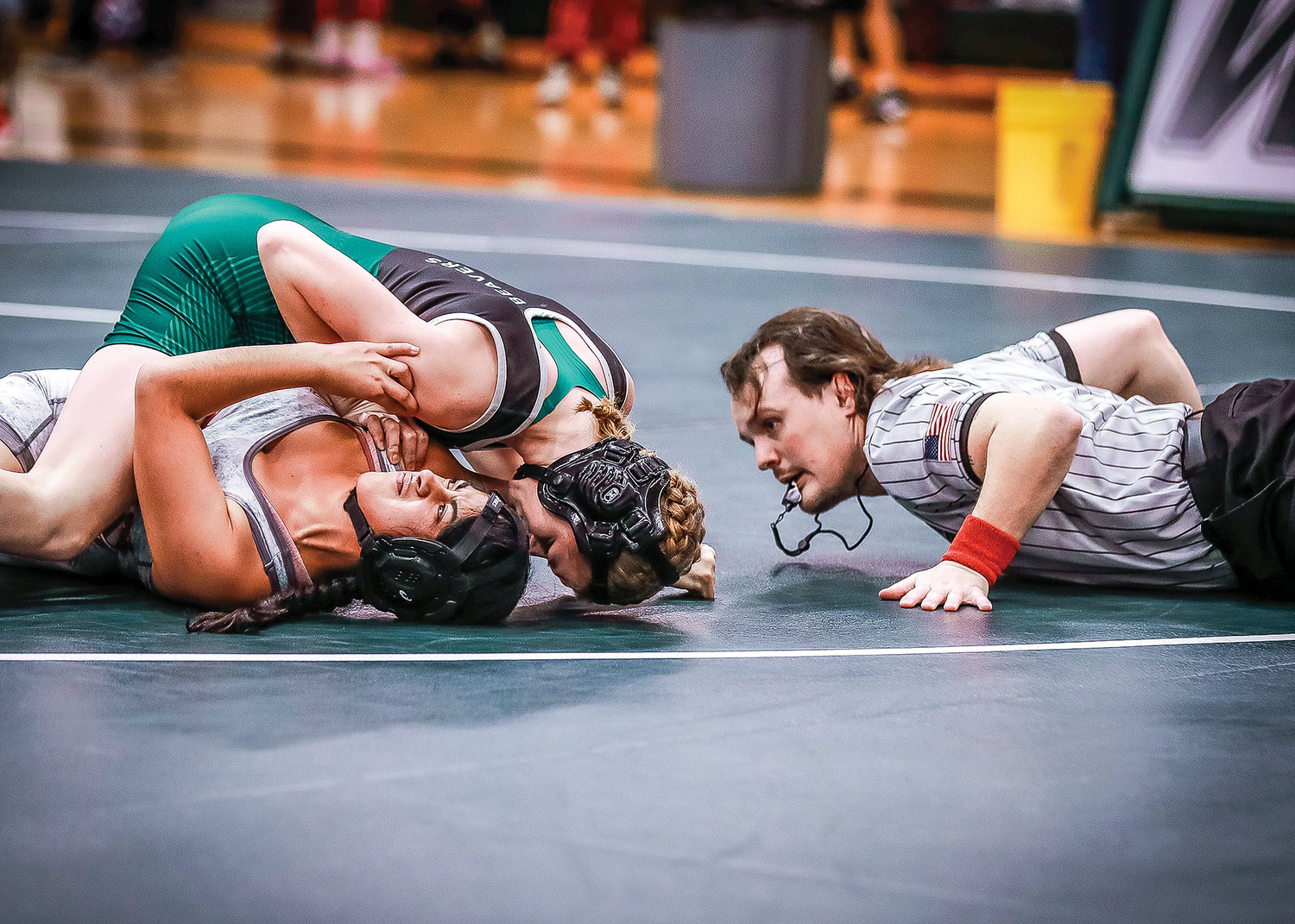 Couly McReynolds, a sophomore at Woodland High School, pins her Fort Vancouver opponent in just 56 seconds of the first round during a home meet on Wednesday, Jan. 11.