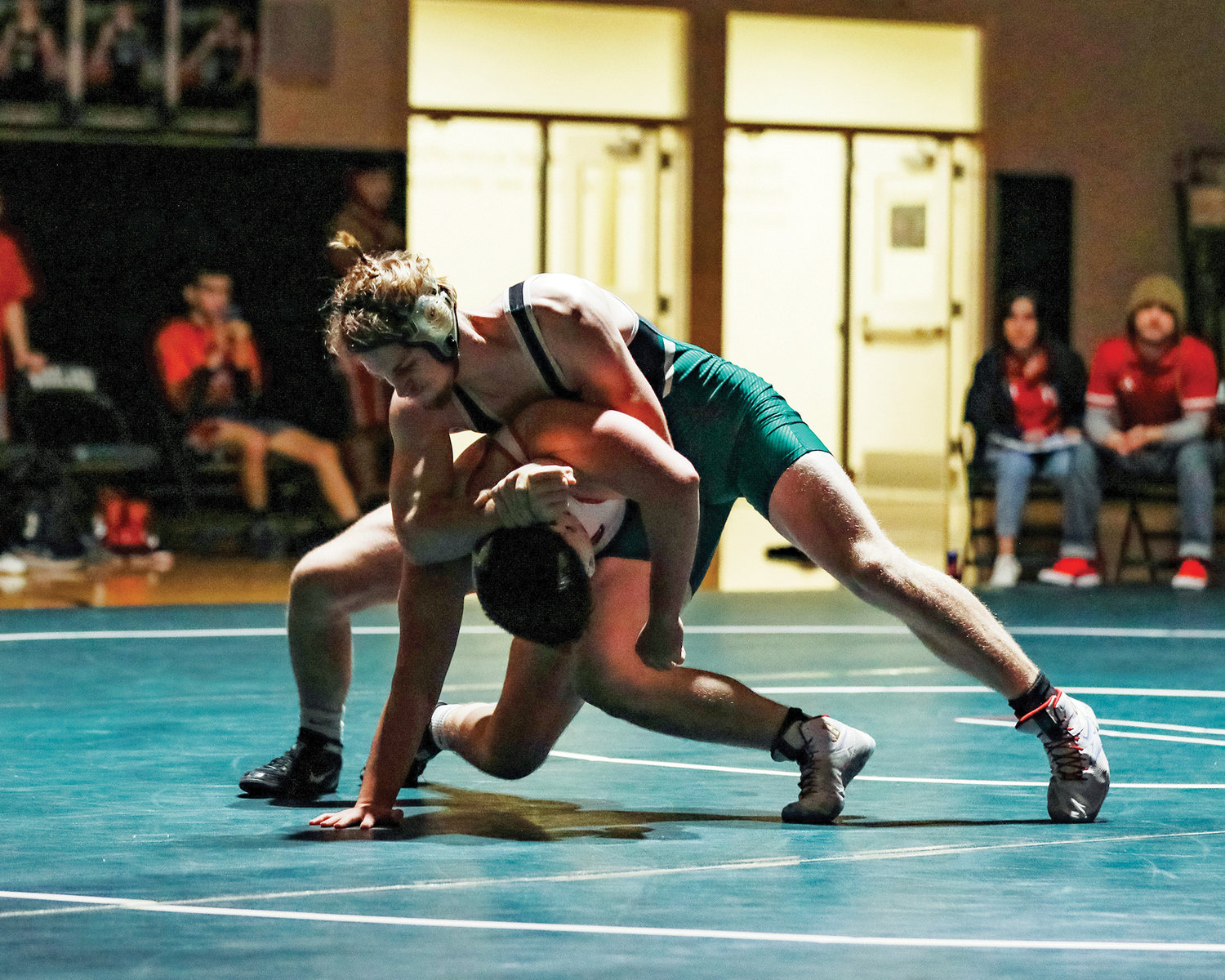 Woodland's Malcolm Karchesky takes down his opponent during a home meet on Wednesday, Jan. 11.