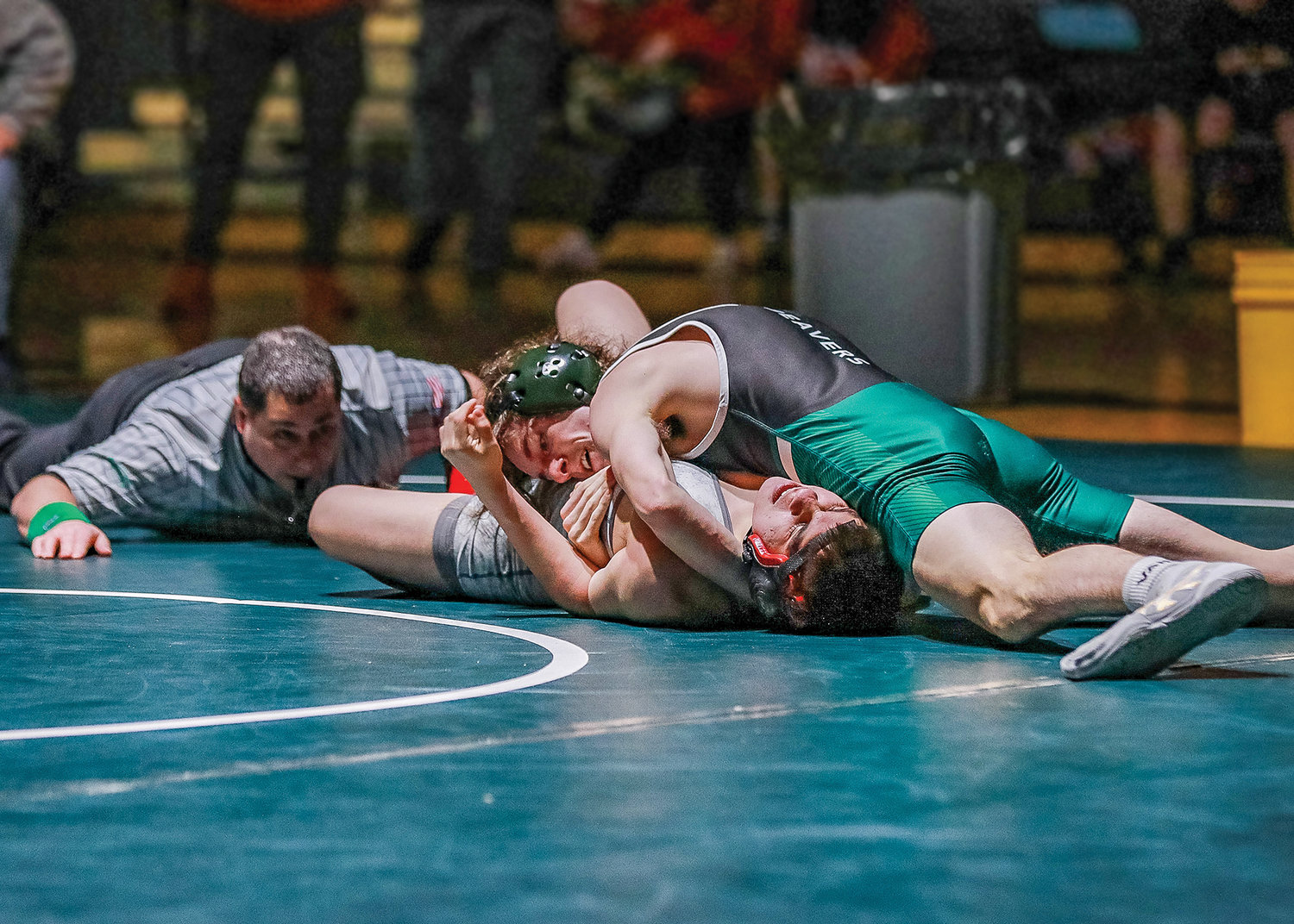 Ryder Reese, of Woodland High School, secures a match winning pin against his Fort Vancouver opponent in a home meet on Wednesday, Jan. 11.