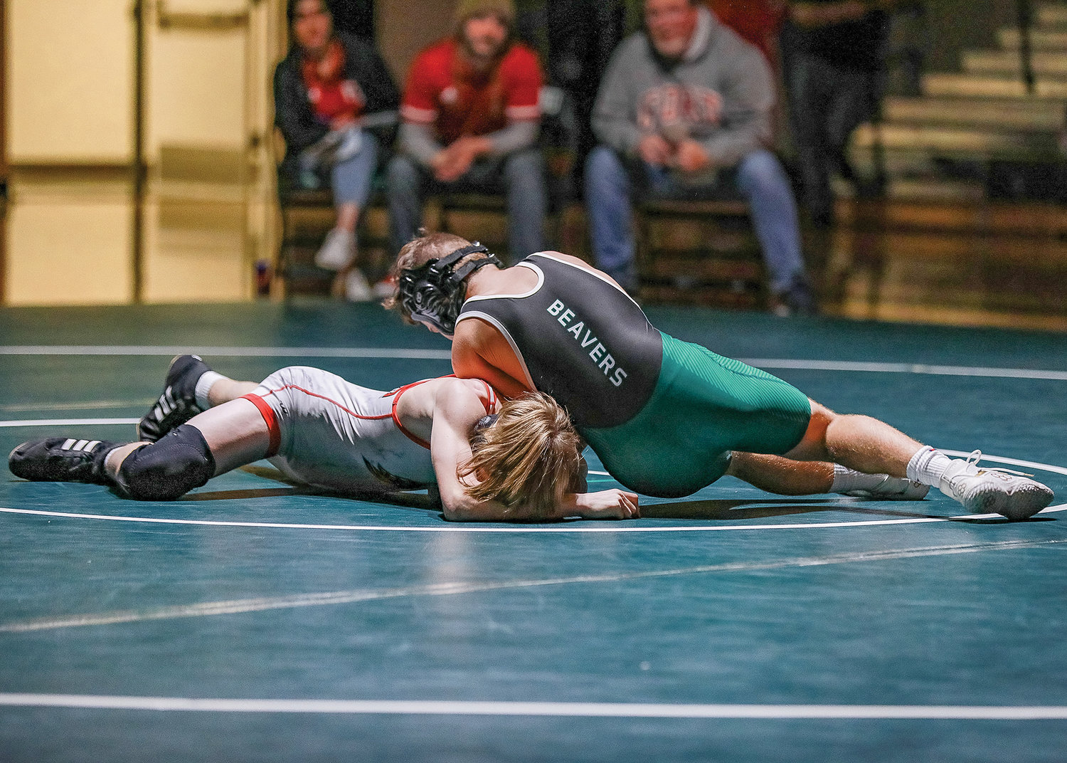 Mateo Gutridge gains a position on a Fort Vancouver wrestler during a home match on Wednesday, Jan. 11.